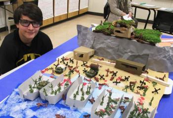 Tristan Pepe helped construct this diorama depicting the WWII D-Day battle. PHIL DI VECE/Wiscasset Newspaper