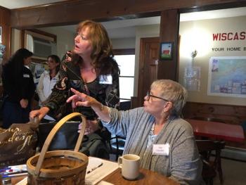 The First's Monique McRae, left, looks where WACC Administrative Assistant Pat Cloutier is showing her. SUSAN JOHNS/Wiscasset Newspaper
