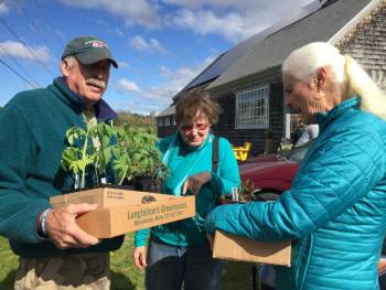 Wiscasset’s Sam and Kayda Selby, foreground, chat with a friend at Morris Farm’s plant sale May 18. SUSAN JOHNS/Wiscasset Newspaper