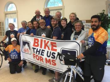 The cyclists on Bike the U.S. for MS’s Atlantic Coast Route pose in First Congegrational Church of Wiscasset’s fellowship hall May 24. SUSAN JOHNS/Wiscasset Newspaper