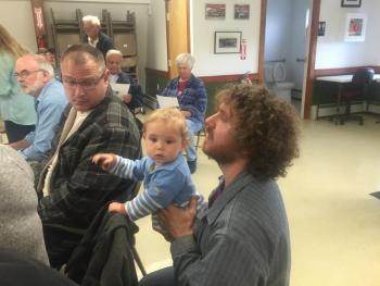 Steve Piwowarski, right, and son John, 1, meet with fellow Alna resident Jeff Spinney before selectmen’s May 30 meeting. SUSAN JOHNS/Wiscasset Newspaper