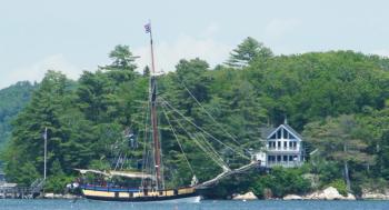 The sloop passes Westport Island. Courtesy of Frank Barnako