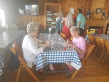 Patricia Fontenoy and Pamala Allen enjoy strawberry shortcake and conversation VANESSA DUNN/Wiscasset Newspaper