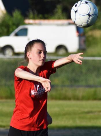 Zoe Waltz throws the ball in for Wiscasset. PHIL DI VECE/Wiscasset Newspaper