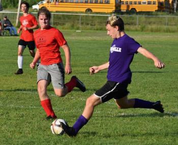 Josh Jones supported by John Hodson applies the pressure on a Waterville player. PHIL DI VECE/Wiscasset Newspaper