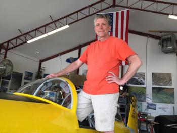Longtime pilot Nick Knobil with his RV-8 plane, “The yellow peril” in his hangar at Wiscasset Municipal Airport July 14. SUSAN JOHNS/ Wiscasset Newspaper