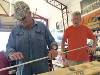 Bowdoinham neighbors and friends Bill Saindon, left, and Nick Knobil work on Knobil’s next plane. SUSAN JOHNS/ Wiscasset Newspaper