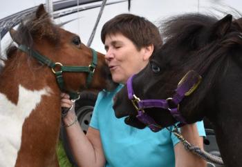 Amy Appleton of Woolwich poses with her miniature horses Cisco, left, and Stella at Woolwich Community Day Aug. 3. PHIL DI VECE/Wiscasset Newspaper