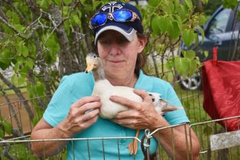 Te’ Kelley, who rescues animals, poses with Kismet, a snowy mallard. PHIL DI VECE/Wiscasset Newspaper
