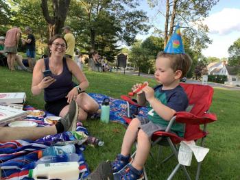 Happy birthday, Alna’s Myrick Blagdon, 2. At left is mom Audrey Blagdon. They and several family members celebrated at “Alive on the Common” in Wiscasset Aug. 1. SUSAN JOHNS/Wiscasset Newspaper
