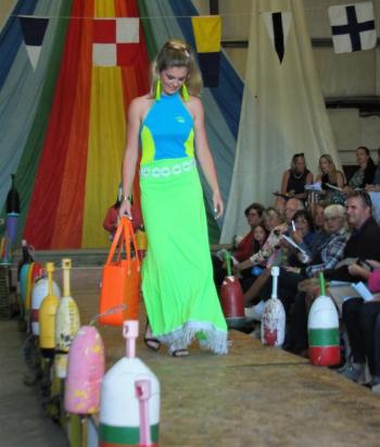 BRHS model Hannah Cola looks divine in the Senior Class design. The neon dress is a nod to the ’60s. Made from a Lil Swimmer suit with cording and fringe from a buoy bag. Smashing! File photo