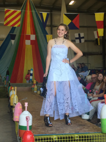 Olivia Paolillo wears a design by Benedict/Andrews Designs – her grandmother Lorna the Andrews half of this design team. This modern gown uses rubberized boat paint on elver netting, zip ties, waterproof canvas, rope, hooks, swivels and lures. She has a black rubber bracelet and silver fishing lure earrings. File photo