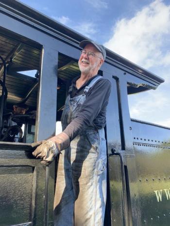 Volunteer Gordon Cook of Acton, Massachusetts serves as fireman for the train at Wiscasset, Waterville & Farmington Railway Museum’s Fall Festival in Alna Sept. 28. SUSAN JOHNS/Wiscasset Newspaper