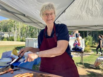 Mary Nickerson cooks for the cause at the volleyball benefit. SUSAN JOHNS/Wiscasset Newspaper