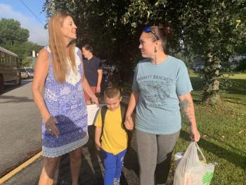 Wiscasset Superintendent of Schools and 2019-20 WES Principal Terry Wood greets pre-kindergartener Timothy Robbins, 5, and his mother Amanda Merritt on opening day, Tuesday, Sept. 3. SUSAN JOHNS/Wiscasset Newspaper