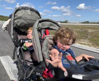 Brentley Ames, 2, and behind him brother Jeramiah, 1, take the speedway on wheels. SUSAN JOHNS/Wiscasset Newspaper