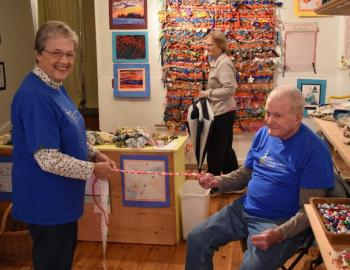Nancy and Wally Roby braid a string for the community tapestry. PHIL DI VECE/Wiscasset Newspaper