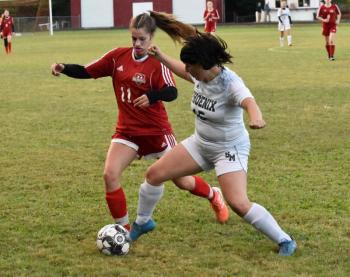 Wiscasset Middle High School rallied but visiting Spruce Mountain was the victor Tuesday. Shown are Cara Viele and Riley Gray of the Phoenix. PHIL DI VECE/Wiscasset Newspaper
