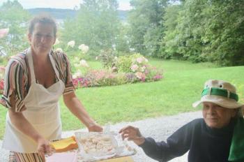 Heather Fifield serves appetizers to Conseula Joerns on the porch of the Marianmade barn. ART MAYERS/Wiscasset Newspaper