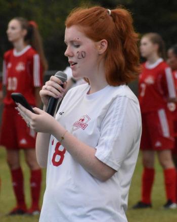 Kaydin Nichols of WMHS sings the national anthem before the start of Saturday’s Homecoming game. PHIL DI VECE/Wiscasset Newspaper.