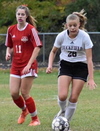 Cara Viele pursues Buckfield’s Lynn Szabo. PHIL DI VECE/Wiscasset Newspaper.