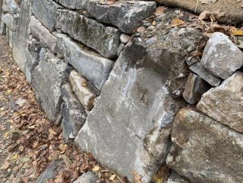 A wall rebuilt with pieces from the dam’s mill years. SUSAN JOHNS/Wiscasset Newspaper