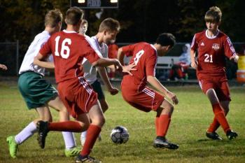 The Wolverines take on the Winthrop Ramblers Tuesday night, Oct. 8. Shown are #16, Gavin Loupe, #8 Matt Eckert and Mason Davenport. PHIL DI VECE/Wiscasset Newspaper