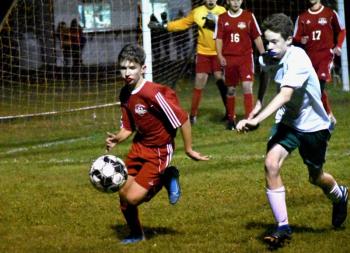 Peyton Blagdon beats a Winthrop player to the ball. PHIL DI VECE/Wiscasset Newspaper