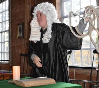 “Hang the evil ones,” says Colonial magistrate Amanda Silverman shaking a hangman’s noose in the ancient court room. PHIL DI VECE/Wiscasset Newspaper