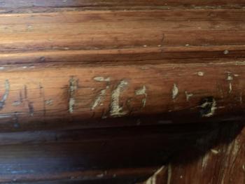 William Dykes believes the home’s first owner, William Groves, carved “1763” on this fireplace. Dykes said the carving turned up under several layers of paint. SUSAN JOHNS/Wiscasset Newspaper