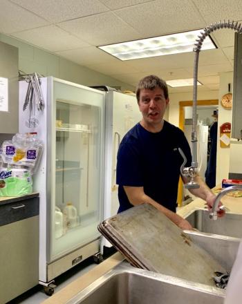 Wiscasset Parks and Recreation Director Duane Goud washes silverware. SUSAN JOHNS/Wiscasset Newspaper