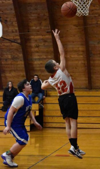 Ethan Demmons drives to the hoop in the fourth quarter. PHIL DI VECE/Wiscasset Newspaper