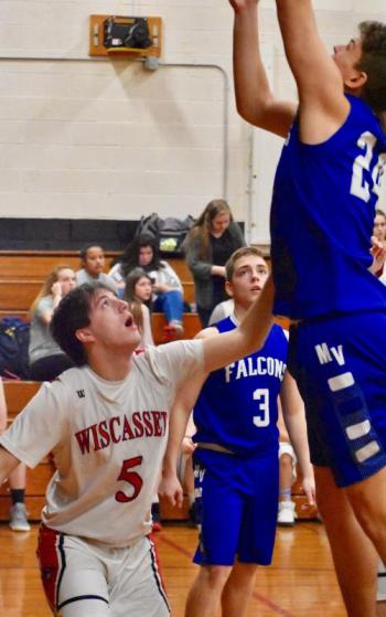 Billy Pinkham can’t stop Falcon Cooper Davis. Also shown Mountain Valley’s Kalen Chase. PHIL DI VECE/Wiscasset Newspaper