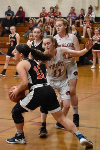 Wolverine Zoe Waltz #11 and Madison Carrier with Lisbon’s Giana Russo. PHIL DI VECE/Wiscasset Newspaper
