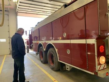 Newly re-elected Alna road commissioner Jeff Verney stands by as a fire truck backs back into the fire station bay where the annual town meeting was held Saturday. SUSAN JOHNS/Wiscasset Newspaper