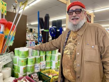 “Big Al” Cohen March 14 with his Wiscasset store’s toilet paper, one of the items he is limiting buying on so some families wouldn’t have to go without. SUSAN JOHNS/Wiscasset Newspaper