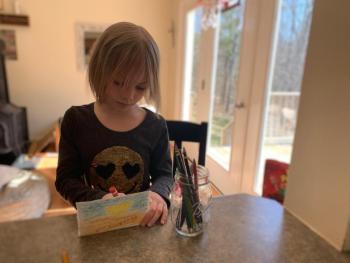 A student works on a card. Courtesy of Damariscotta Montessori