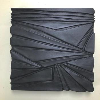“Number 6: one in a series of seven mahogany, carved relief wall sculptures, 11” x 11” x 1” in the sunlight, by Eben Blaney. Eben Blaney.