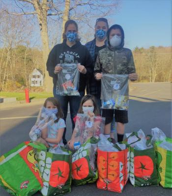 Action For Animals members and volunteers brought 50 treat bags for the Boothbay and Boothbay Harbor fire departments. Front, from left: Isabella and Abigail Lockesmith; back, from left: Lisa Smith, Betsy Pitcher and Kale Rogers. LISA KRISTOFF/Boothbay Register