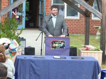 Edgecomb Eddy Principal Ira Michaud congratulates the school’s 11 graduates during the June 5 ceremony. BILL PEARSON/Boothbay Register