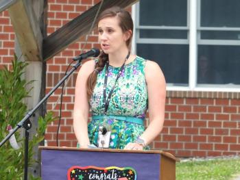 Sixth grade teacher Julie Browne announces Julian Deliso as the top academic graduate. BILL PEARSON/Boothbay Register