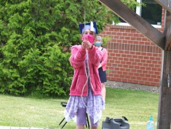 Edgecomb Eddy graduate Rebecca Fassett rings the school bell one last time June 5 during the graduation ceremony. BILL PEARSON/Boothbay Register