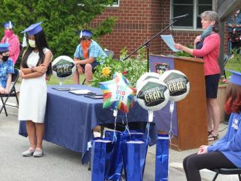 Music teacher Jennifer McIvor presents graduate Ziera Lei Bercasio with the Edgecomb Eddy Arts Award. BILL PEARSON/Boothbay Register