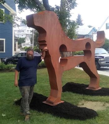 Artist Dale Rogers and his work, “The Dog” at McKown Square. Bill Royall photo