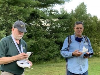 Kenneth Steeves, left, pilots his drone as another attendee stands nearby. SUSAN JOHNS/Wiscasset Newspaper
