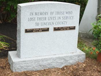 Lincoln County commissioners hosted a dedication service Aug. 4 for a monument to the memory of two deputies who died in the line of duty. BILL PEARSON/Boothbay Register