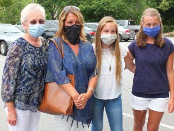 Rindy (Davey) Cushman, left, was joined by daughter Cecily Havener, second left, and granddaughters Grace Havener and Ruth Havener, right, during a ceremony honoring her husband Don Davey, who died responding to an emergency in 1984. BILL PEARSON/Boothbay Register
