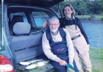 Ray and Pat salmon fishing in Canada. Courtesy of the Cave family