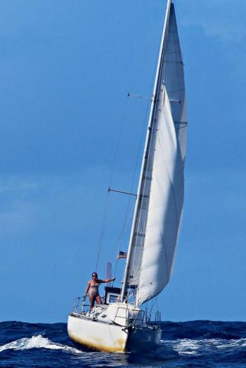 Holly Martin single-hands her 27-foot Grinde double ender sloop Gecko as she approaches Nuku Hiva island in the Marquesas during her journey around the world. Courtesy of Holly Martin