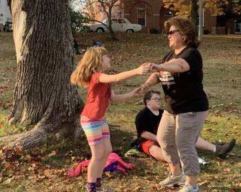 Lotus LaFrance, 8, of Edgecomb dances with mother JoEllen Saturday afternoon on Wiscasset common to the music of Salty Dogs on Scarecrowfest’s opening day. SUSAN JOHNS/Wiscasset Newspaper